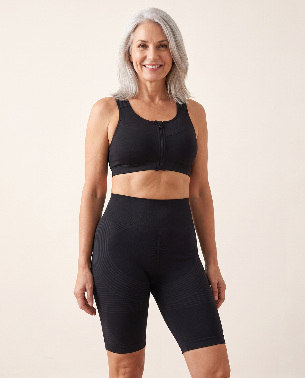 The Active Set worn — black legging, short and zip bra